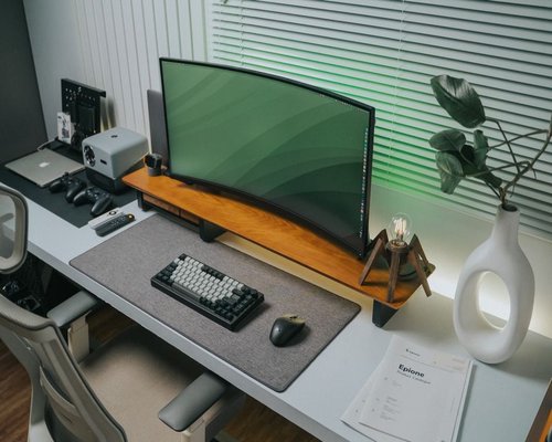 A well-organized modern home office desk with ergonomic setup